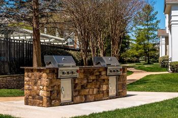 Charcoal and gas grills with picnic style seating